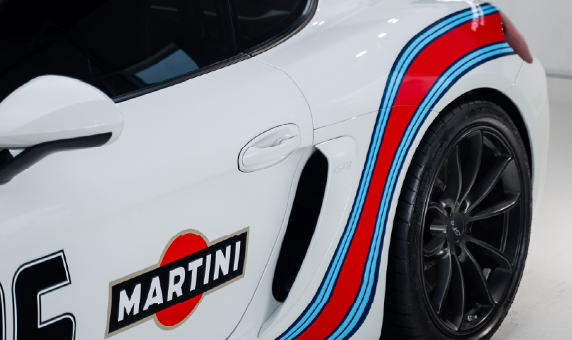 Porsche PPF – Premium Protection for Martini Livery and Paintwork Porsche sports car with Martini racing livery protected by PPF for enhanced paint durability and style.